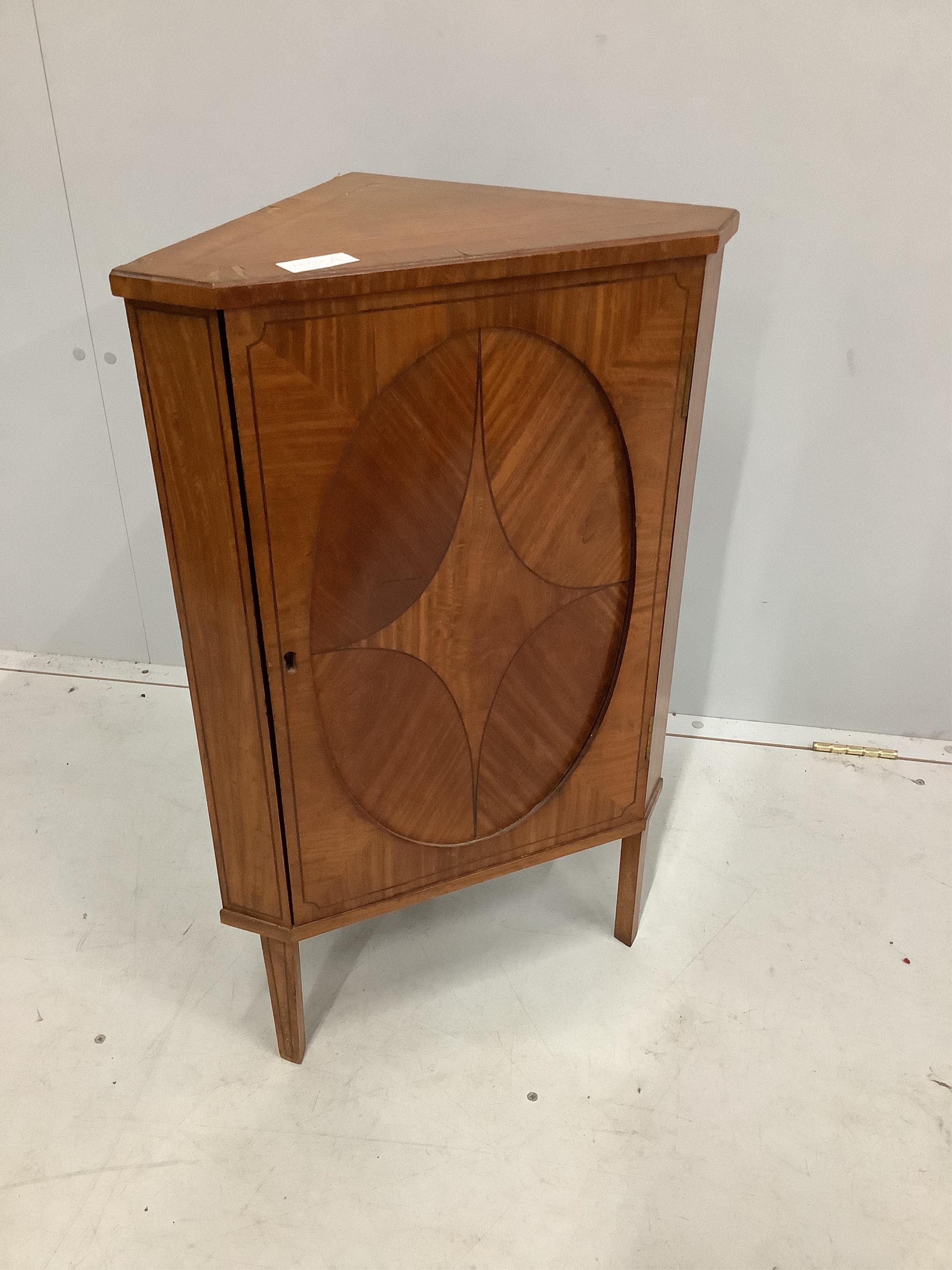 A small Edwardian satinwood corner cabinet, width 48cm, depth 29cm, height 77cm. Condition - poor to fair